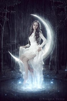 a woman in white dress sitting on the moon