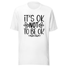 "It's Okay Not To Be Okay" - this statement is more than just a T-shirt, it's a powerful reminder of resilience and strength. This unisex tee is the perfect way to show your support for mental health awareness and self-care. It's a great gift for any occasion, from birthdays to holidays, and is sure to inspire courage and hope in the wearer.This T-shirt is more than just a fashion statement - it's a reminder that it's okay to not be okay. It's a reminder that it's enough to just be yourself, and Meaningful Text Print Crew Neck T-shirt, Meaningful Quote Print Crew Neck T-shirt, Meaningful Relaxed Fit T-shirt With Letter Print, Meaningful Graphic Print Crew Neck T-shirt, Funny Short Sleeve T-shirt With Lettering, Relaxed Fit T-shirt With Meaningful Text Print, Funny Cotton T-shirt With Lettering, Inspirational Crew Neck T-shirt With Lettering, Meaningful Graphic Print Short Sleeve T-shirt