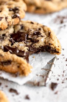 Chocolate chip cookie with a bite taken out of it. Tahini Chocolate Chip Cookies, Jar Of Lemons, Tahini Chocolate, Homemade Holiday Gifts, Healthy Cookie Recipes, Delicious Cookie Recipes, Dark Chocolate Chips, Yummy Cookies, Cookie Recipe