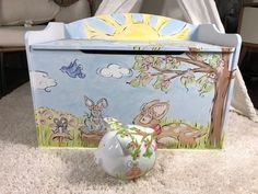 an animal themed toy box sitting on the floor