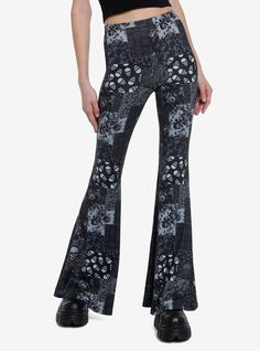 Keep your look artsy with a splash of darkness in these flare leggings! It features a monochromatic allover paisley skull patchwork print and a bellbottom flare leg. Stretchy waistband.95% polyester; 5% spandexWash cold; dry lowLength: 42"Stretchy materialImportedListed in junior sizesModel is 5'10"Model wears size Small Cheap Fitted Bottoms With Star Print, Hot Topic Skull Pants, Fuzzy Skull Pants, Skull Pant, Pants Skull, Skull Patchwork, Patchwork Leggings, Social Collision, Dark Style