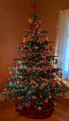 a decorated christmas tree in a living room