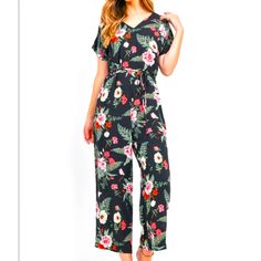 Black Short Sleeve V-Neck String Belt Wide Leg Floral Print Midi Jumpsuit. Made In: China Fabric Content: 100% Polyester Size Small Measurements: L: 50" B: 36" W: 22" I.S.: 23" Model In Photos Is Wearing A Small. Neutral Jumpsuit, Summer Printed V-neck Jumpsuit, Midi Jumpsuit, Red Printed V-neck Jumpsuit, Casual Floral Print V-neck Jumpsuit/romper, Red Floral Print Jumpsuit With V-neck, Pink Floral Print V-neck Jumpsuit/romper, Boutique Pants, Yellow Jumpsuit