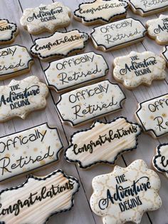 decorated cookies are displayed on a table for guests to enjoy the day and be served