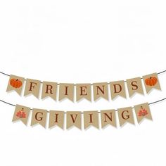 a banner that says friends giving with pumpkins and leaves on the front hanging from a string