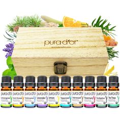 an open wooden box filled with bottles of essential oils