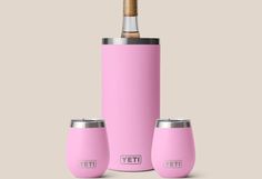 the yeti insulated wine bottle is shown with its corked top and two empty glasses