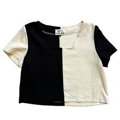 This modern black and cream color blocked patchwork top from Ersa Fibers features a square neckline, short sleeves, loose fit, and slightly cropped length. Its loose fit makes it ideal for layering to be worn year round and its bright bold design and clean lines make it a go-to statement piece. Made in Portland, Oregon Modern Cotton Color Block Tops, Summer Color Block Short Sleeve Crop Top, Casual Color Block Short Sleeve Crop Top, Modern Black Crop Top For Summer, Short Sleeve Patchwork Top In Contrasting Colors, Contrast Patchwork Short Sleeve Top, Casual Black Color Block Crop Top, Black Square Neck Top For Summer, Black Square Neck Summer Top