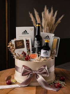 a wine and chocolate gift basket on a table