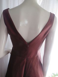 "1990's sleeveless, deep-V front/back bronze/dark brown cocktail dress, by Nicole Miller of New York, in a size 6. Dress has a big flared circle skirt, with attached under slip of silk/netting, back nylon zipper, outer dress fabric is silk. Front bodice is in a deep-V cleavage in a large bust bow look, as well as a deep-V bodice back. Dress is in great condition, Bust 32 1/2\", Waist 28\". PRICE IS $179.00------SALE FINAL/AS IS/NO RETURNS." Elegant Brown Lined Dress For Evening, Elegant Brown Lined Evening Dress, Sleeveless Brown Evening Dress, Brown Sleeveless Evening Dress, Brown Cocktail Dress, Brown Cocktail, Outer Dress, Brown Flares, Flowing Dresses