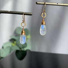 "Moonstone Earrings, Teardrop Earrings, June Birthstone, Earrings for Women, Gemstone Earrings, Gift for Girlfriend, Dangle Earrings, Gift for Her Sometimes less is more. Our polished Teardrop Moonstone earrings need no introduction. They are our \"clear\" favorite, no pun intended! Refreshingly light for wearing every day yet bold enough to take center stage for special occasions. When you want to dress up your outfit with the perfect balance of understated glamour, this earring is for you. The Moonstone Drop Earrings For Gift, Moonstone Crystal Drop Earrings For Gift, Hypoallergenic Moonstone Dangle Earrings, Moonstone Crystal Dangle Earrings, Moonstone Dangle Earrings With Ear Wire, Moonstone Drop Earrings With Ear Wire, Everyday Moonstone Gemstone Earrings, Dainty Moonstone Drop Earrings, Moonstone Teardrop Gemstone Earrings