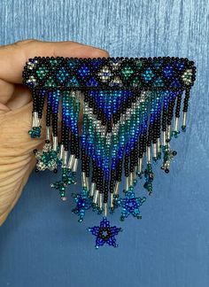 Beaded Blues, black and silver Diamond design Dangling stars Substantial on but light Metal clip Label/Stamp: none Condition: Excellent condition with no real wear. See pics. Sold as is. Measurements: 3 7/8 x 3.75" (9.84 x 9.52cm) Provenance: mid1990s Care: occasionally wipe with soft cloth, as desired Check measurements and/or convo with ANY questions prior to purchase as there are no returns. 2024106 Beaded Hair Clip, Beaded Hair Clips, Beaded Hair, Antique Clothing, Jewelry Pins, Hair Beads, Barrette Clip, Bead Embroidery, Diamond Design