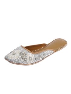 These Silver Juttis are made of Leather and embellished with Sequins Work by designer 5 Elements by Radhika Gupta. Be different. Go for stylish juttis and buy the latest footwear now. Color: Silver Fabric: Upper- Silk blend fabric - leather lining cushion for extra comfort & pure leather sole Note: Heel type - Flat The product will be shipped within 20-25 days of the order placed Care intructions - Keep in dust bag, dry clean only, embellished accessory needs to be handled with care. You can als Elegant Flats For Reception, Handwork Flats For Festive Summer Occasions, Festive Handwork Leather Flats, Embellished Flats For Wedding, Festive Leather Flats With Handwork, Leather Flats For Wedding And Festive Occasions, Festive Zari Work Flats For Summer, Elegant Handwork Flats, Elegant Embellished Flats For Festivals