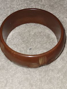 "I will combine shipping on all purchases and refund any overages after shipping fees and insurance. In good vintage condition. Genuine bakelite. Approximately 7.75\" inside. This is a light milk chocolate color that has carved cross looking designs all the way around it. Please look at the pictures for details and condition or message me with any questions" Bakelite Bangles, Chocolate Color, Taffy, Vintage Butterfly, Milk Chocolate, All The Way, Chocolate Milk, Bangle Bracelet, Swarovski Crystals