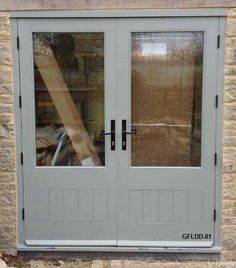 the front door to a building with two glass doors