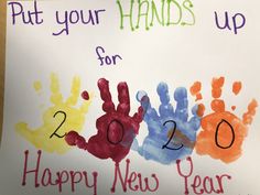 a sign that says put your hands up for 2012 happy new year with hand prints