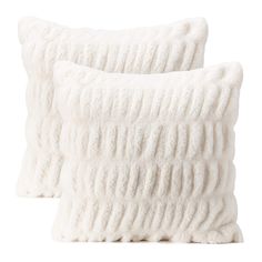 two white pillows sitting next to each other