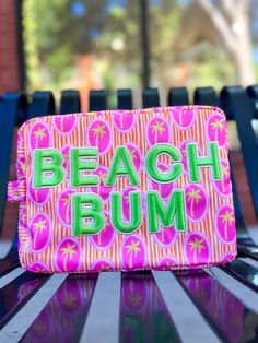 Pack your bags, beach bum! The Beach Bum XL travel bag is ready for your next sunny getaway. With a playful palm tree print and vibrant hot pink color, this bag will make you stand out on the beach. Don't forget to snap a pic for Insta! #vacaygoals". Pink Beach Bag For Vacation, Pink Poolside Bags For Beach Season, Pink Tropical Beach Bag For Vacation, Pink Tropical Beach Bag For Travel, Pink Tropical Style Beach Bag For Vacation, Pink Tropical Style Beach Bag For Travel, Pink Tropical Beach Bag, Tropical Pink Beach Bag, Fun Pink Beach Bag For Travel