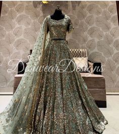 Made to Order/Measurement/Custom Order Lehenga - Color : sage green - Fabric : Embroidered georgette - Fully flared paneled lehenga - Embroidered  Blouse -  Net Dupatta with Gold Border - Drawstring closure with Tassels - - It can be customize in any design or size  PLEASE NOTE: BUYERS ARE RESPONSIBLE FOR ANY CUSTOMS AND IMPORT TAXES THAT MAY APPLY. This is a made to order product. If you opt for 'Made To Measurement Option', we will provide a measurement template and you can share the measurements likewise. If you want to opt for 'Standard Size', Please refer to the size chart provided in the listing. Shipping: Standard Shipping is done by DHL ecommerce and it mostly takes 2 to 3 weeks to deliver after dispatch. Express Shipping is done by DHL express and it mostly delivers within a week Traditional Sequined Salwar Kameez For Wedding, Heavy Bollywood Style Dupatta For Eid, Bollywood Style Heavy Dupatta For Eid, Heavy Bollywood Dupatta For Eid, Art Silk Anarkali Set For Wedding Party, Sequin Anarkali Set For Wedding Party, Bollywood Style Sequined Salwar Kameez For Wedding, Bollywood Style Kundan Gown For Party, Heavy Bollywood Dupatta For Diwali