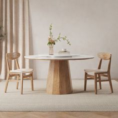 a white table with two chairs around it