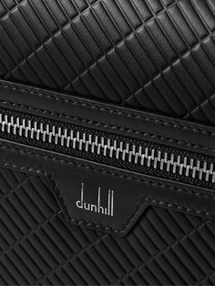 Dunhill has been crafting leather goods for over 130 years. This Italian-made 'Contour' messenger bag is designed with an embossed front flap and hand-painted edges. It's has practical pockets an an adjustable webbing strap. Designer Embossed Travel Bags, Designer Embossed Formal Bag, Designer Formal Bag With Embossed Details, Designer Embossed Bags For Formal Occasions, Designer Formal Embossed Bags, Modern Leather Shoulder Bag With Engraved Logo, Leather Shoulder Bag With Engraved Logo For Travel, Classic Formal Bags With Embossed Details, Classic Formal Embossed Bags