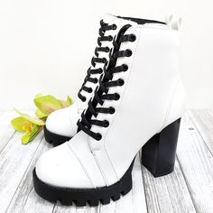 Look Stylish In These Newly Arrived White Block Heel Combat Boots New In Box Man Made Leatherette Material Black Lace And Heel Lightly Padded Insole Side Zipper For Easy Shoe Removal Lug Sole Block Heels Heel Height: 4 In. Fitting: True To Size White Heel Boots, Heel Combat Boots, White Block Heels, Black And White Heels, White Boots, Look Stylish, Lug Sole, Wedge Sneaker, Chunky Heel