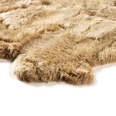 an animal fur rug is laying on the floor