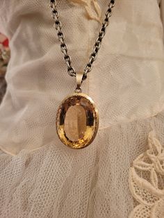 Rare beauty! This is the largest pendant I've ever seen. I am not sure of stone, probably a glass? Setting is old Claw style wit no markings, so it could  be a gold-filled, not sure. Very old and well made. It came from Europe. I've w9rn it on a heavy chain. It is heavy and large. Measures 2.5 inches long including bail and 1.5 inches wide. 1/2 inch thick. Really good condition, with minimal surface wear. It's a crazy cool piece if you collect antique jewelry.  Chain is not included. Other hearts/items not for sale. Antique Gemstone Oval Pendant Jewelry, Antique Oval Pendant Gemstone Jewelry, Antique Oval Pendant Jewelry With Gemstone, Vintage Gemstone Jewelry For Memorial, Antique Gemstone Jewelry For Memorial, Collectible Oval Amber Necklaces, Amber Jewelry With Large Stone For Anniversary, Formal Gold Jewelry With Large Stone, Antique Citrine Gold Jewelry