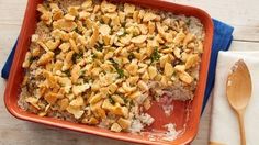 a casserole dish with chicken and rice in it