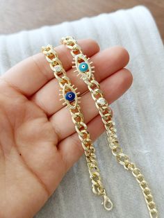 G O L D ∙ C U B A N ∙ C H A I N ∙ E V I L  E Y E ∙ B R A C E L E T 18k Gold Cuban Link Chain Bracelet, Greek Evil Eye Bracelet, Gold Curb Chain Bracelet, Gift for Women, Evil Eye Protection  ♥ It is a gold cuban chain bracelets which are the most unique jewelry you can find with charm. ♥ These Evil Eye Bracelets are perfect gift for you and your loved ones.  ♥  Please choose evil eye colors during checkout  ♥ Material: High quality stainless steel with plated  ♥ All our evil eye jewelries are ni Gold Evil Eye Bracelet With Charms As Gift, Gold Evil Eye Bracelet With Charms For Gift, Gold Charm Bracelet With Evil Eye, Gold Metal Evil Eye Bracelet As Gift, Gold Metal Evil Eye Bracelet For Gift, Chain Link Charm Bracelet With Adjustable Chain Gift, Gift Chain Link Charm Bracelet With Adjustable Chain, Gift Charm Bracelet With Adjustable Chain Link, Gift Chain Link Charm Bracelet