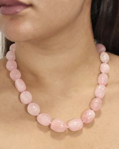 Natural untreated Rose Quartz Crystals in graduating sizes are worked into luscious beads in this gorgeous hand-strung necklace. A vintage classic, this eminently wearable necklace will be treasured for years to come. Sivalya Natural Rose Quartz Crystals Style: Knotted with Clasp Crystals Size: 1" - 1.5" Necklace Length: 20 inches Cut: Natural Untreated Cabochons Rose Quartz: Love, Friendship, Inner Healing Pink Quartz Necklace, Crystals Necklace, Inner Healing, Rose Quartz Beads, Quartz Crystals, Rose Quartz Crystal, Pink Quartz, Quartz Necklace, Quartz Stone