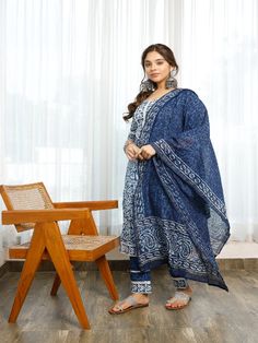 Affordably stylish every day clothing. This handmade indigo bagru print A cotton a-line kurti with gota detailing is tastefully decorated with flower designs. includes a lace-trimmed pant and a chanderi indigo-printed dupatta with paisley borders on the ends. You must have ethnic clothing in your collection this season. Neck: Round Neck Sleeve Length: 3/4th Sleeves Kurta Length: Calf Length Fabric: Kurta & Bottom - Cotton Dupatta - Chanderi Note: Wash Care Instructions - Dry Clean Only. The prod