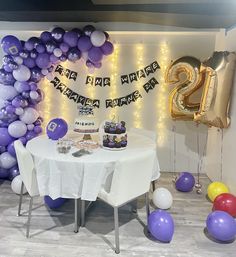 a table that has some balloons on it