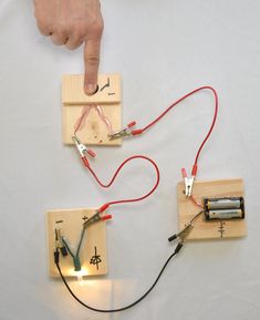 two electronic devices connected to each other with wires attached to the boards and plugged in