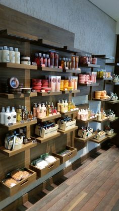 shelves filled with lots of different types of items on wooden shelves next to each other