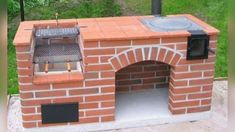 an outdoor brick pizza oven in the middle of a yard