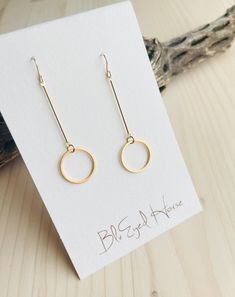 Lightweight and airy, gold-plated bar and circle style earrings. These hang approx. 2.25 inches in length. Gold filled ear wires. Handcrafted in the USA All BluEyed Horse Jewelry items come beautifully wrapped, perfect for gift giving! Gold Hoop Threader Earrings For Gift, Gold Round Threader Earrings For Everyday, Minimalist 14k Gold Filled Circle Earrings, Simple Linear Ear Wire Earrings As Gift, Simple Linear Earrings With Ear Wire As Gift, Modern 14k Gold Filled Linear Earrings Gift, Horse Jewelry, Detail Shop, Style Earrings