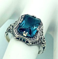 Vintage London Blue Simulated Topaz In 925 Solid Sterling Silver Ring. Excellent Condition, Satisfaction Guaranteed! December Birthstone Hallmarked Emerald Cut Topaz Ring In Sterling Silver, Victorian Blue Topaz Ring In Silver, Turquoise Topaz Ring In Sterling Silver For Anniversary, Victorian Style Silver Ring With Blue Topaz, Formal Turquoise Topaz Ring In Sterling Silver, Sterling Silver Topaz Ring With Intricate Design For Gift, Victorian Silver Blue Topaz Ring, Sapphire Filigree Ring With Sterling Silver, Blue Topaz Jewelry Collectible