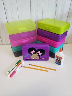 "Isn't she adorable?   These pencil boxes (8\" x 5\" x 2) come personalized, you can choose the bow color and earring color.  Please note her nail polish will match her bows and name will match earring color.  You will have a choice of box color. When ordering please select box color and vinyl colors for hair bow and earrings.  If you are ordering more than 10 boxes please contact us for a bulk discount." School Supplies Pencil Case, Custom Pencil Boxes, School Supplies For Kids, Personalized Pencil Boxes, Butterfly Party Decorations, Girl School Supplies, Personalized School Supplies, Curious George Party, Curious George Birthday