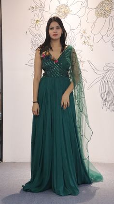 A mix of royal and modern, this long dress in Sea Green colour handcrafted on georgette with multicolour crystal and stripes has an entirely different look because of the jacket. Style this for the classic indo western look.Fabric- georgette with net, work- metal stripes with multicolor crystalOccasion: Wedding ,Cocktail, Family & Pooja,Reception ,EngagementNo. Of Components: 1 Style: Gown Fabric: Georgette Work: Sequin, Cut dana Colour: Sea Green Chest: 36 Note:- Originally Stitched in 36 but c Sea Green Colour, Indo Western Gown, Saree Petticoat, Full Sleeve Blouse, Saree Jewellery, Sea Green Color, Lehenga Skirt, Ready To Wear Saree, Half Sleeve Blouse