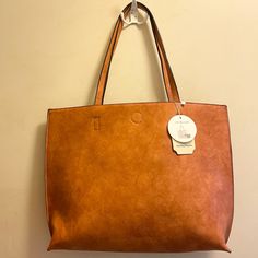 Nwt. Camel Outside, Taupe Inside. Comes With Pochette, Wallet, Shoulder Bag. Dust Bag Included. 18.5” L 13.5” W Casual Dark Tan Shoulder Bag For Everyday Use, Casual Dark Tan Bag For Everyday Use, Casual Dark Tan Bag, Brown Reversible Travel Bag, Reversible Brown Shoulder Bag For Travel, Casual Everyday Bags With Interior Card Slots, Brown Reversible Bags For On-the-go, Brown Reversible Shoulder Bag For On-the-go, Reversible Brown Shoulder Bag For On-the-go