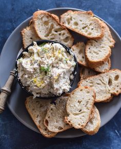 a plate with bread and dip on it