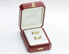 Created with Shogun. Cartier CufflinksVintage Cartier stirrup sapphire 18K yellow gold cufflinks. It comes in original Cartier box. Approximate Measurements: Length 1", Width 0.78", Weight: 10.7 Grams. Polished Yellow Gold Earrings For Business, Yellow Gold Screw Back Cufflinks For Anniversary, Anniversary Yellow Gold Screw Back Cufflinks, Hallmarked Yellow Gold Cufflinks For Formal Occasions, Luxury Rectangular Cufflinks For Anniversary, Antique Yellow Gold Cufflinks For Formal Occasions, Antique Yellow Gold Formal Cufflinks, Timeless Yellow Gold Cufflinks For Anniversary, Luxury Screw Back Earrings For Formal Occasions