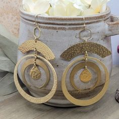 Look like the star of the night with these Large Gold Statement Hoop Earrings! Crafted with a brass gold finish and textured crescent hoops, these earrings will have you turning heads with the perfect combo of sophistication and style. Feeling sassy? Rock these out for a look that's out of this world! Brass textured components Brass ear hooks Length is 4" Created in studio - Wilmington, NC Statement Hoop Earrings, Brass Texture, Wilmington Nc, Brass Gold, Ear Hook, Out Of This World, The Star, This World, Gold Finish