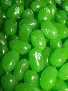 green candy with white writing on it