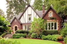 a large brick house surrounded by lush green trees and bushes in front of it is the words credit jeff herr