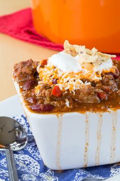 a chili casserole with sour cream on top