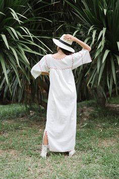 "Beautiful Antique 0ff-White Cotton Gauze Maxi Dress with Floral Hand Embroidery . Features hand embroidered flowers on chest front, neck and sleeves. Half Sleeve drawstring at cuff sleeves. Condition: Good Vintage Condition. ** black spot on hip area and missing embroidered detail on skirt. \"shown in the detailing picture \" BEST FIT = M Please be sure to check the measurements to insure a perfect fit. Details and Measurements (Inch) BUST: 38 \" HIPS: 50 \" FULL LENGTH: 52 \" SLEEVE LENGTH: 11 White Intricate Embroidery Vacation Dress, Red Maxi Dress With Chikankari Embroidery, White Dress With Intricate Embroidery For Vacation, White Dresses With Intricate Embroidery For Vacation, Red Chikankari Embroidery Summer Dress, Red Chikankari Embroidery Maxi Dress, Red Chikankari Embroidered Maxi Dress, White Embroidered Beach Dress With Embroidered Hem, Cotton Short Sleeve Dress With Embroidered Border