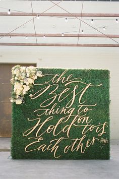 a sign that says the best guests to golden wedding each other on top of a grass wall