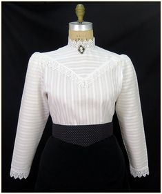 "100% Cotton. Color: Light Ivory. Stripe pattern light weight weave cotton fabric with matching light ivory white poly lace trim. Trimmed collar, cuffs and front bodice yoke. Classic Edwardian design. Lightly gathered full length sleeves with button back. Generously cut for comfort. Machine washable. Circa 1898-1910. Made in U.S.A. Sizes: SM, MED, LG & XLG. Blouses ordered by bust measurement, inches:  BUST           SIZES 32\" - 34\"     SMALL 35\" - 39\"     MEDIUM 40\" - 44\"     LARGE 45\" - White Swatch, Edwardian Design, Light Ivory, Cotton Blouse, Ivory White, Cotton Blouses, Ivory Color, Selling Jewelry, Cotton Weaving